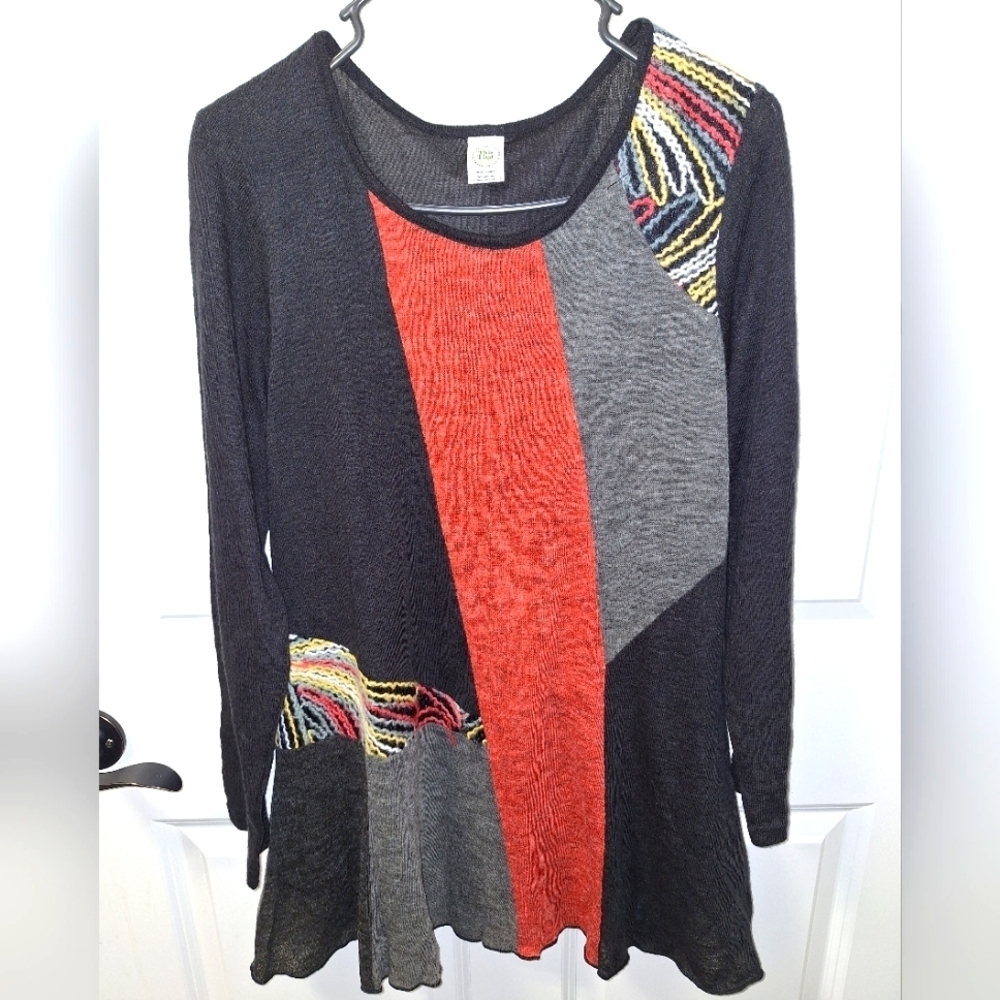 A This & That ladies color block sweater dress in a size medium.